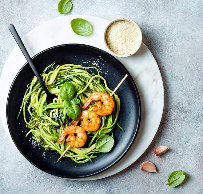 Prawn skewers with zucchini noodles and avocado pesto